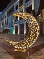 Crescent moon decoration display for Ramadan and Eid celebration. 