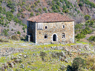 Aerial image of a historical abandoned fortified house build on the top of a rocky hill over 200...