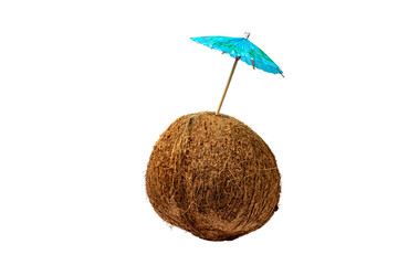 a ripe coconut with a cocktail umbrella suggesting making a tropical drink like a pina colada isolated on white - obrazy, fototapety, plakaty