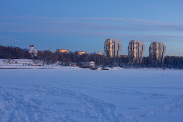 Picturesque view of the icy snow-covered river against the sky