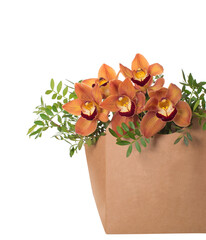 Bouquet of cymbidium orchids in a cardboard box. Isolated - obrazy, fototapety, plakaty