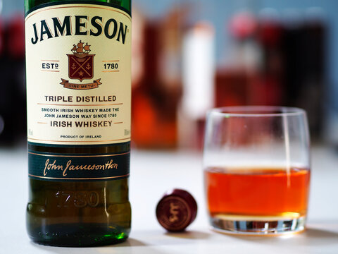 In this photo illustration, a bottle of Jameson Irish Whiskey  seen displayed on a table.