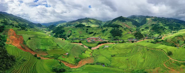 Cercles muraux Mu Cang Chai Aerial top view of fresh paddy rice terraces, green agricultural fields in countryside or rural area of Mu Cang Chai, mountain hills valley at sunset in Asia, Vietnam. Nature landscape background.