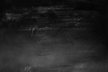 Old black grunge background. Dark board texture. Abstract wallpaper
