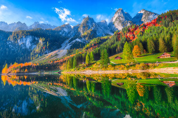 Fototapeta premium autumn scenery with Dachstein mountain summit reflecting in crystal clear Gosausee mountain lake