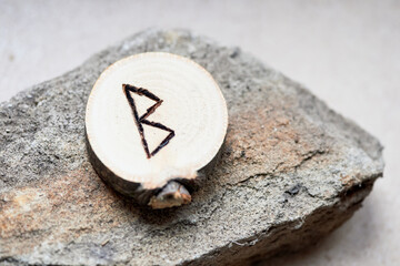 Berkan rune. Wood burning. Rune of feminine strength and fertility