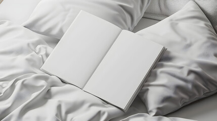 Open book for mock up, on white bed in the bedroom.