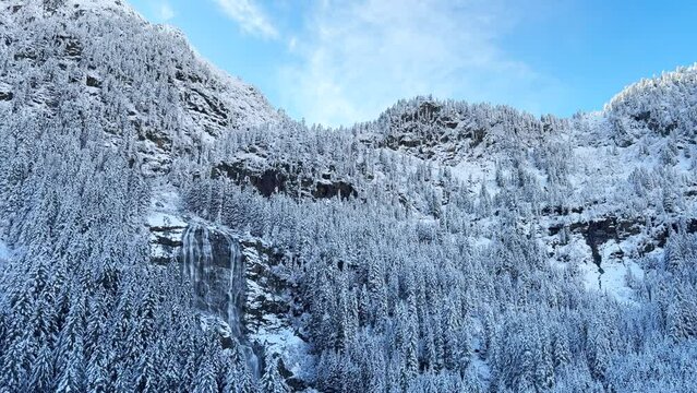 First snow early morning frozen waterfall October November fall autumn river waterfall boulder rocks Stubai Stubaital glacier ski resort Tyrol Innsbruck Austrian Europe Alps mountain pan