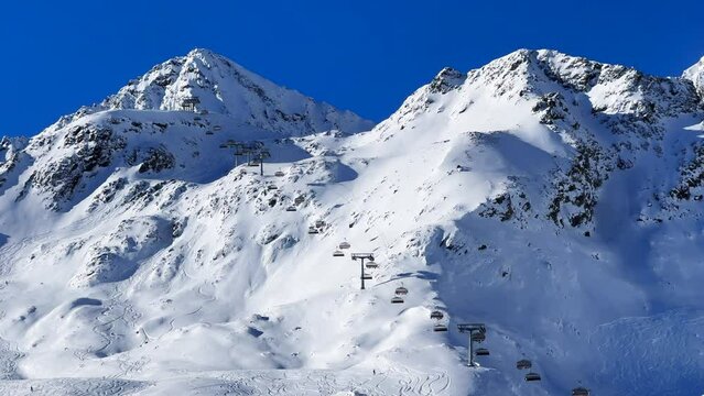 Chairlifts Austrian Europe Alps mountain glacier glacial tall peaks November fall autumn Stubai Stubaital glacier ski resort Tyrol Innsbruck ski snowboard powder runs fresh snow blue sky morning