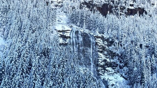 First snow snowing white out frosted waterfall October November fall autumn river waterfall boulder rocks Stubai Stubaital glacier ski resort Tyrol Innsbruck Austrian Europe Alps mountain pan