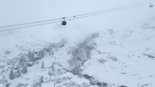 First snow snowing white out blizzard October November fall autumn Gondola Tram chairlift ride Stubai Stubaital glacier ski resort Tyrol Innsbruck Austrian Europe Alps trail run down mountain pan