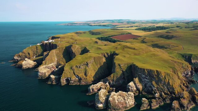 Soaring Views of the Natural Scottish Wonders of Majestic Cliff Views and St Abbs Lighthouse, Scotland, United Kingdom.
