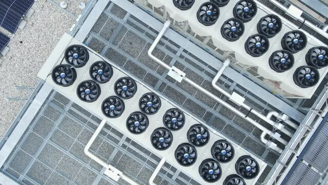 Cooling And Ventilation System Of Data Storage Center Warehouse Building. aerial topdown rotating shot