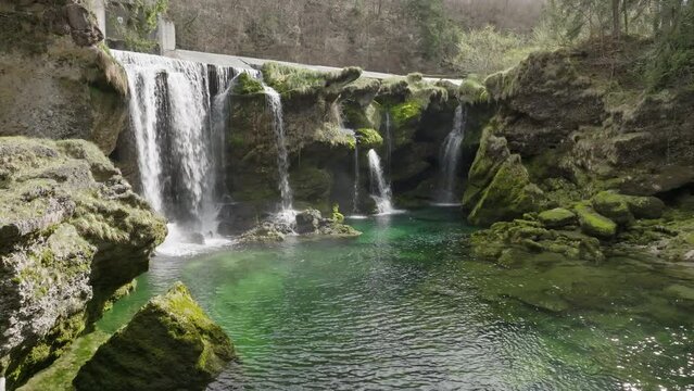 A smooth cinematic shot approaching Traunfall waterfall in Austria slowly