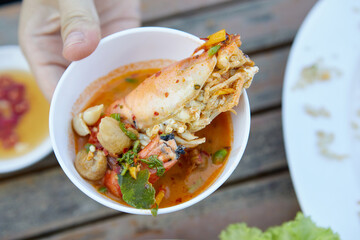 Spicy Tom Yum Goong and sour Thai food  in a bowl