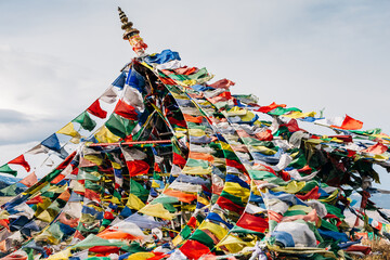 Colorful Buddhist prayer flags blowing in the wind