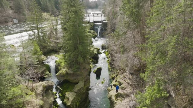 a slow downward panning cinematic shot overlooking Traunfall Austria