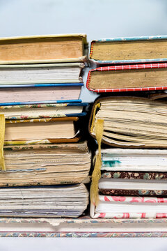 Closeup cropped photo of a stack of used journals