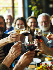 A heartwarming picture capturing a diverse group of people, each raising a glass of wine in celebration. The image showcases the power of unity and diversity, reminding us that joy, friendship