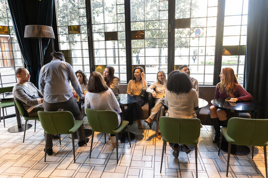 group of friends sitting at a restaurant table