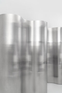Fancy polished metallic bent room dividers indoors