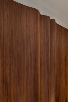 Closeup view at wavy wooden wall indoors
