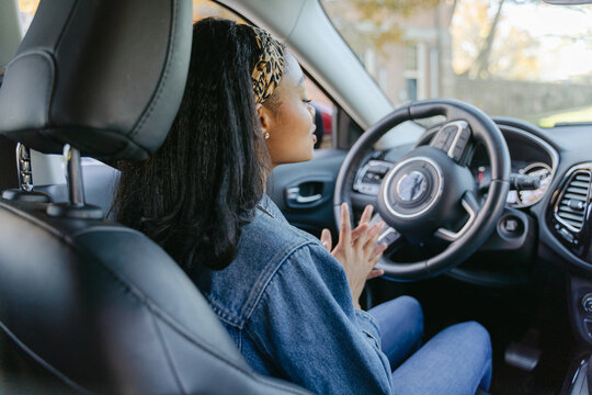 young woman getting ready to drive