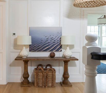 Contemporary home foyer door with artwork on wal 