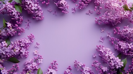 A lilac flower arrangement with a purple background and copy space in the middle of the image.