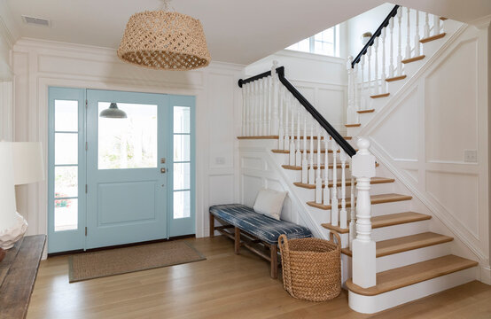 Contemporary home foyer door with stairway 
