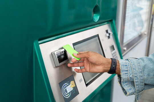 Man Taking Train Paying With credit card