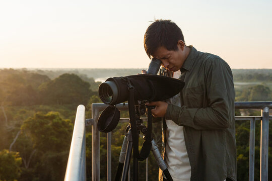 Man birding with a telescope