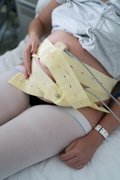 A woman monitoring uterine contractions during pregnancy 