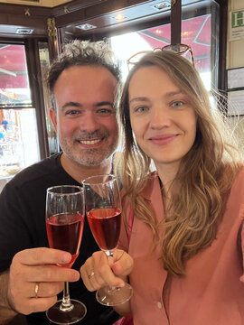 Selfie Of Couple Holding Rose Cava