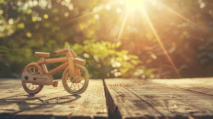 Old miniature wooden bicycle on wooden table. World bicycle day. Vintage beauty on display. - Powered by Adobe