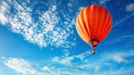 Fototapeta premium hot air balloon soaring high in the endless blue sky!