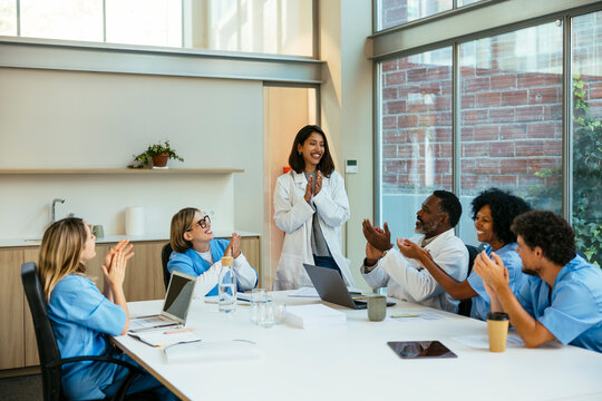 Female doctor having a presentation to medical colleagues