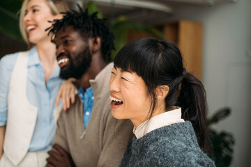 Coworkers posing in modern office