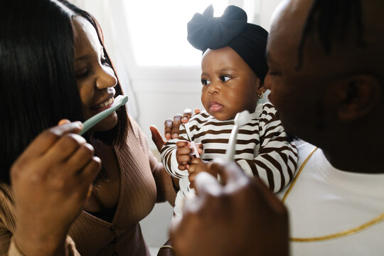 Family brushing teeth