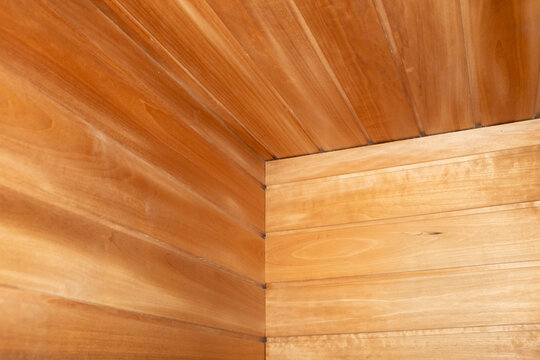 Close-up of modern wooden sauna with hard direct flashlight
