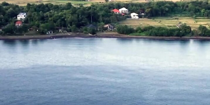 aerial video of a freshwater lake with villas and beautiful views around it
