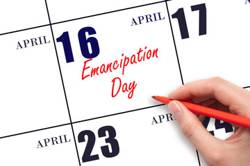 April 16. Hand writing text Emancipation Day on calendar date. Save the date.