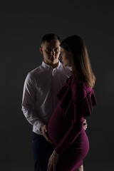 portrait of a couple, pregnant couple, pregnancy woman in a dress