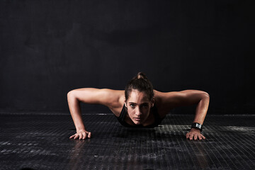 Fototapeta na wymiar Fitness, push up and portrait of woman in studio for arm muscle training with mockup space. Sports, workout and female athlete with strength exercise for health or wellness by black background.
