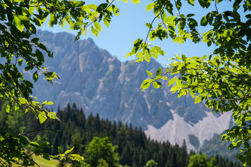 Panoramic view of majestic mountain ridges of Karawanks in Bodental, Carinthia, Austria. Looking at majestic summit of Vertatscha and Hochstuhl. Remote alpine landscape in Austrian Alps in summer
