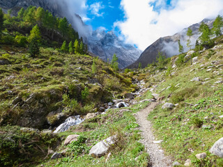 Panoramic long distance hiking path Carnic Peace trail in majestic Carnic Alps, Carinthia, Friuli Venezia-Giulia, border Italy Austria. Idyllic wilderness Austrian Alps. Wanderlust in alpine terrain