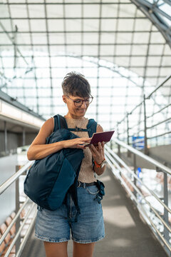 Female traveler checking her passport.