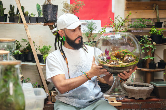 Man holding a terrarium