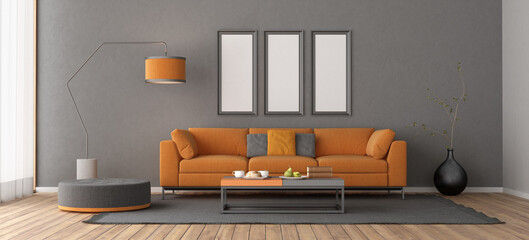 Elegant home decor scene featuring a vibrant orange sofa, sleek furnishings, and neutral tones