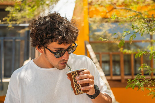 Young Man Drinking Mate